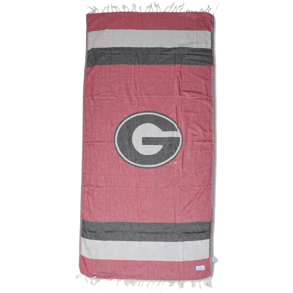 University of Georgia Turkish peshtemal beach towel with Bulldogs logo, shown laid flat to highlight its lightweight cotton fabric and team design.