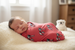 Baby swaddled in University of Georgia knit swaddle