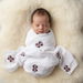 Baby wrapped in Mississippi State muslin swaddle - overhead view