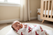 Baby wrapped in Virginia Tech muslin swaddle