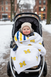 Toddler in stroller with Michigan four layer muslin blanket - winter scene
