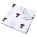 Texas Tech University muslin swaddle blanket with Red Raiders logo pattern, lightweight 47x47 cotton baby swaddle displayed to show design and fabric texture.