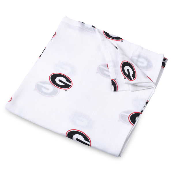 A folded white swaddle blanket with the University of Georgia Bulldog logo repeated throughout.